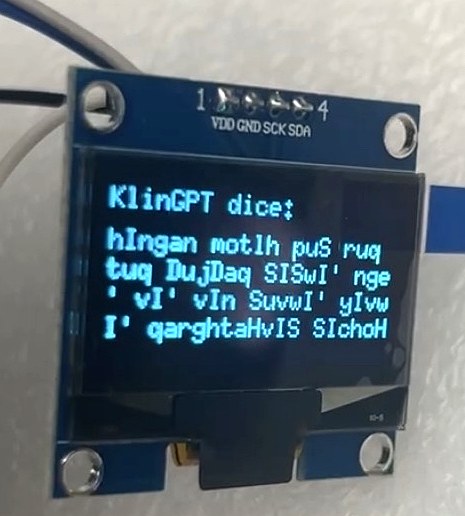 Close-up of the OLED display reading 'KlinGPT dice:' followed by several lines of generated Klingon-looking text